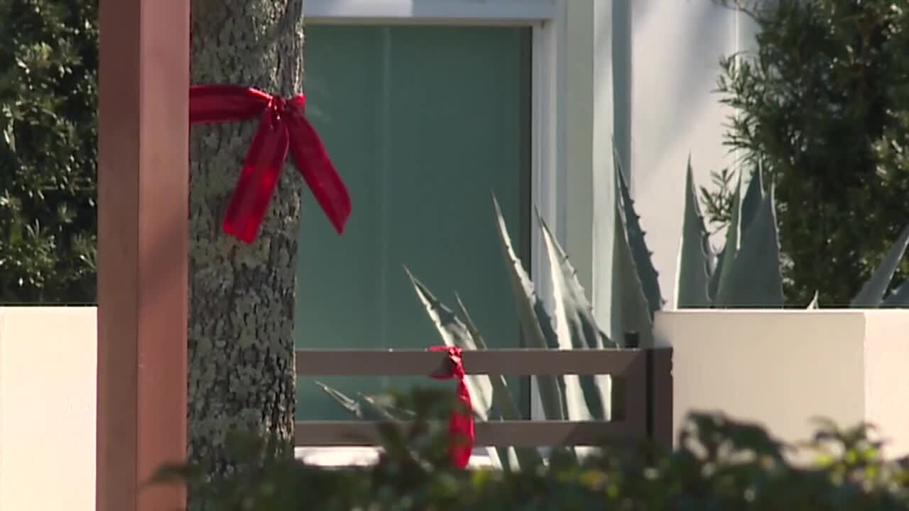 red ribbons on display in Alton neighborhood where Ryan Rogers lived, Nov. 29, 2021