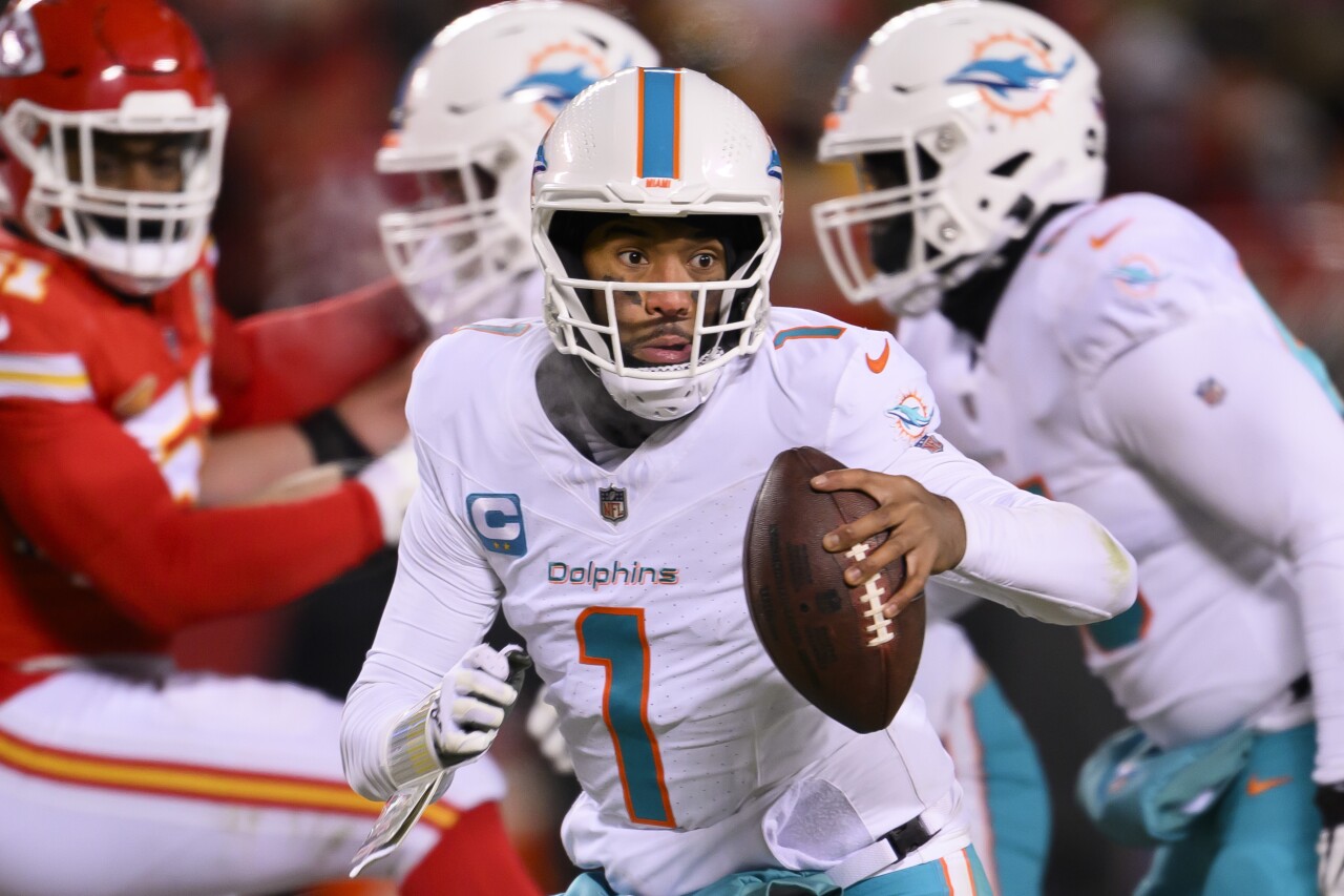 Miami Dolphins QB Tua Tagovailoa runs away from Kansas City Chiefs defense in second half of wild-card playoff game, Jan. 13, 2023