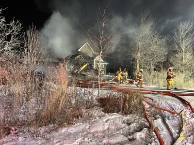House heavily damaged in De Pere fire, road closed