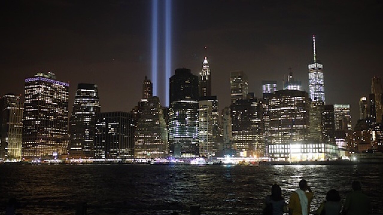 Marking 15 years since 9/11, families arrive at ground zero
