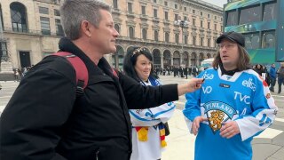 WPTV anchor Mike Trim interviews fans of Team Finland in Milan, Italy, on Feb. 10, 2026.