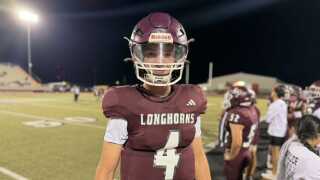 Longhorns player is all smiles on the sideline in Week 12 game