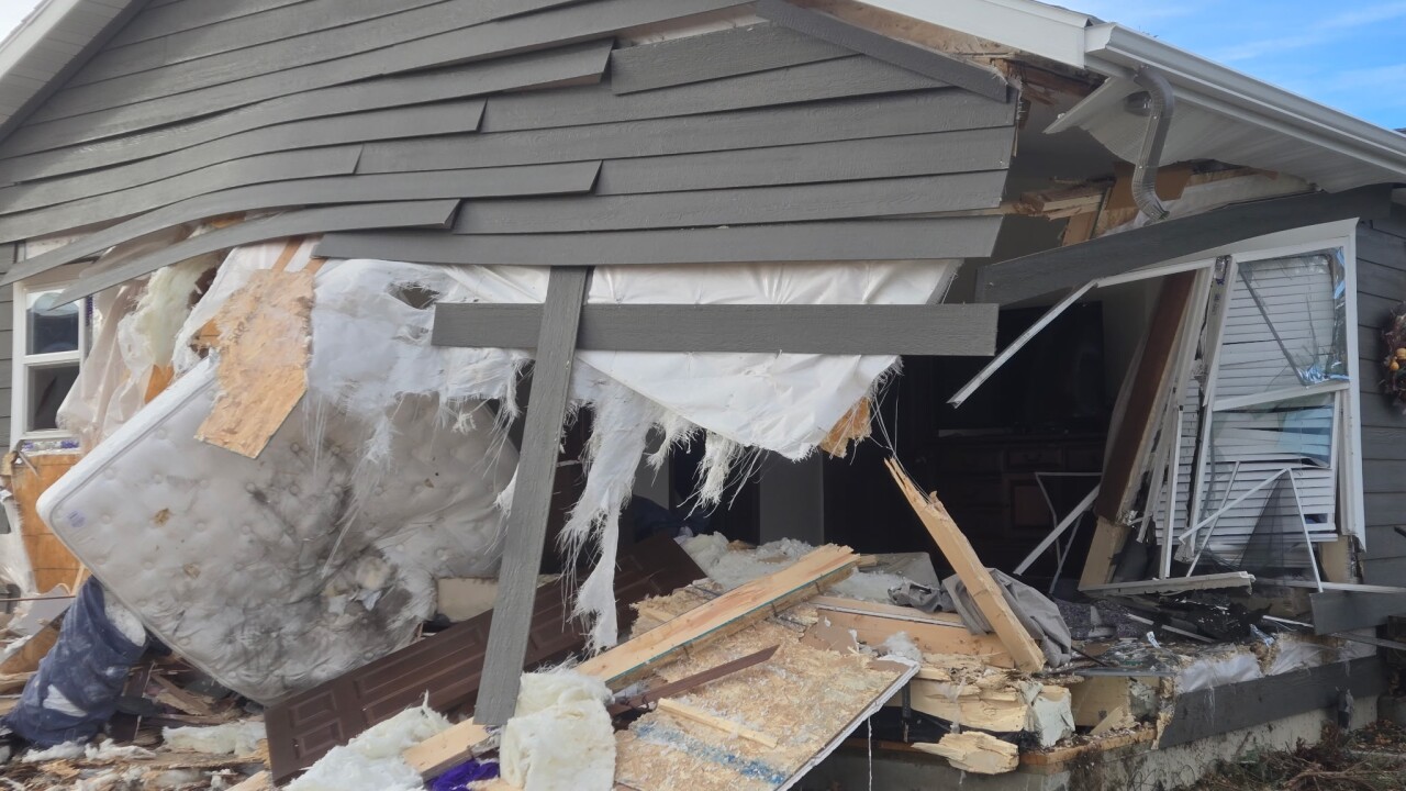 Woman killed after car pursued by MHP crashes into house