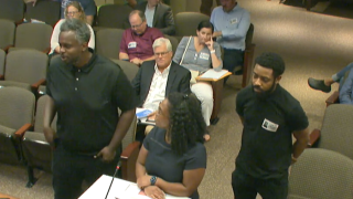 Jeffeary Miskiri (left) and Kevin Satia-Watng Nanji (right) speak at a recent Baltimore liquor board hearing about Miss Toya's Creole House