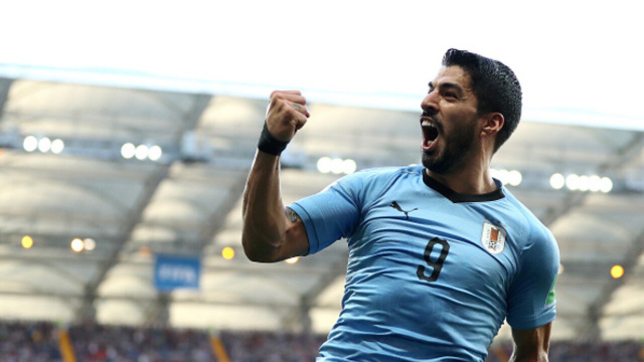 Suarez Scores As Uruguay And Russia Advance Suarez Scores As Uruguay And Russia Advance