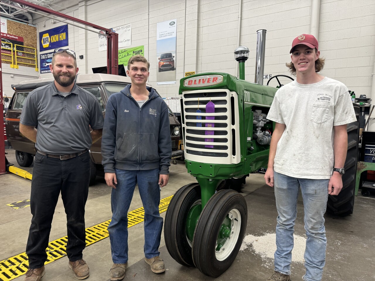 Teacher Austin Thorson poses with some of his students.
