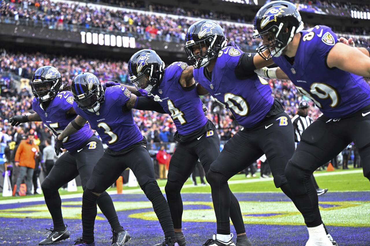 Baltimore Ravens receiver Zay Flowers celebrates with teammates by doing 'swag surf' dance after touchdown in first quarter of AFC Championship, Jan. 28, 2024