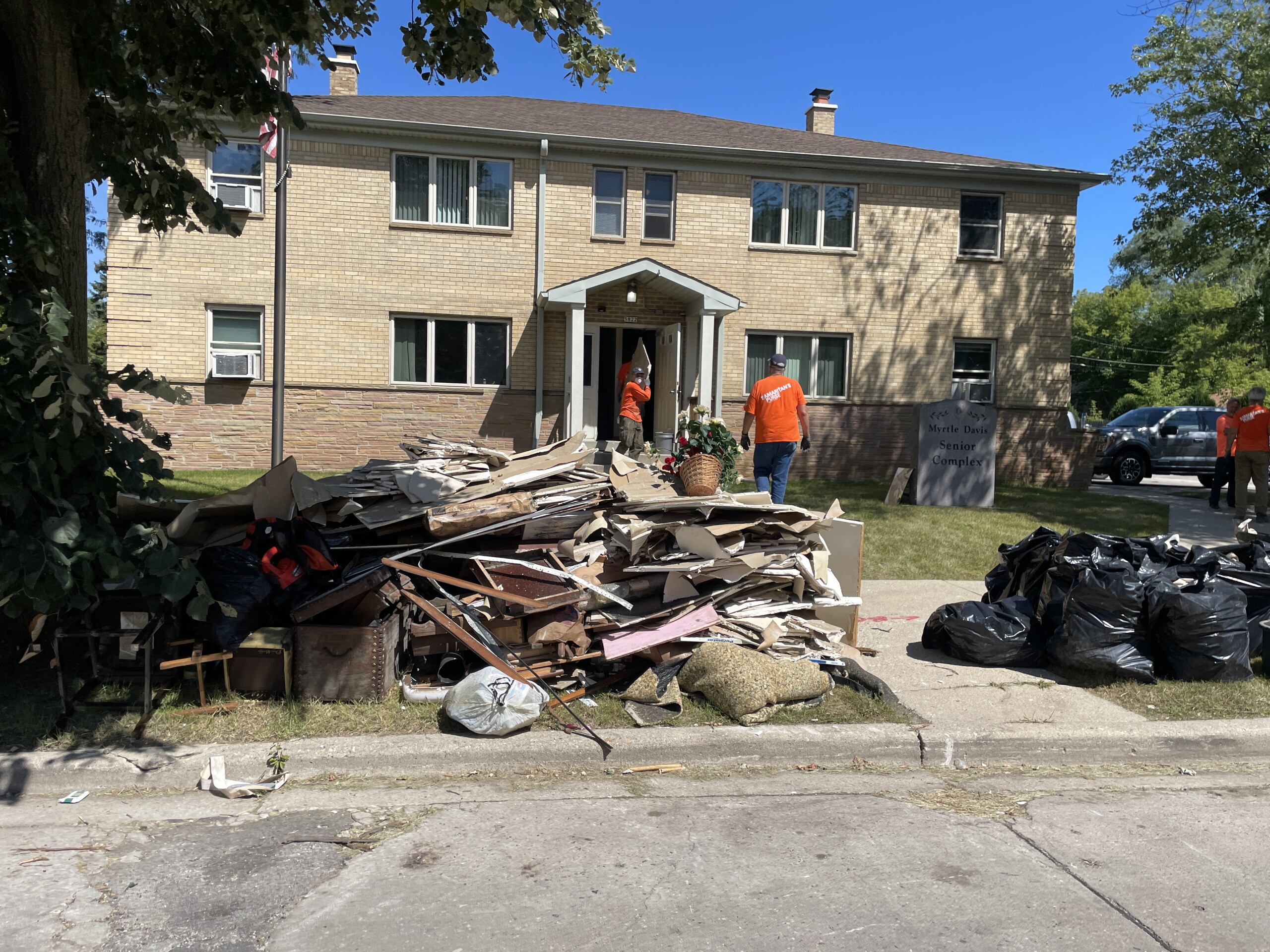 Volunteers rebuild after flooding forces seniors from Milwaukee housing ...