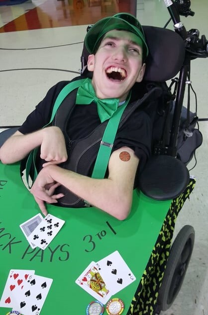 Ethan Kadish smiles in this photo that shows him in the blackjack dealer Halloween costume that Stephanie Johnstone Wagner made for him.