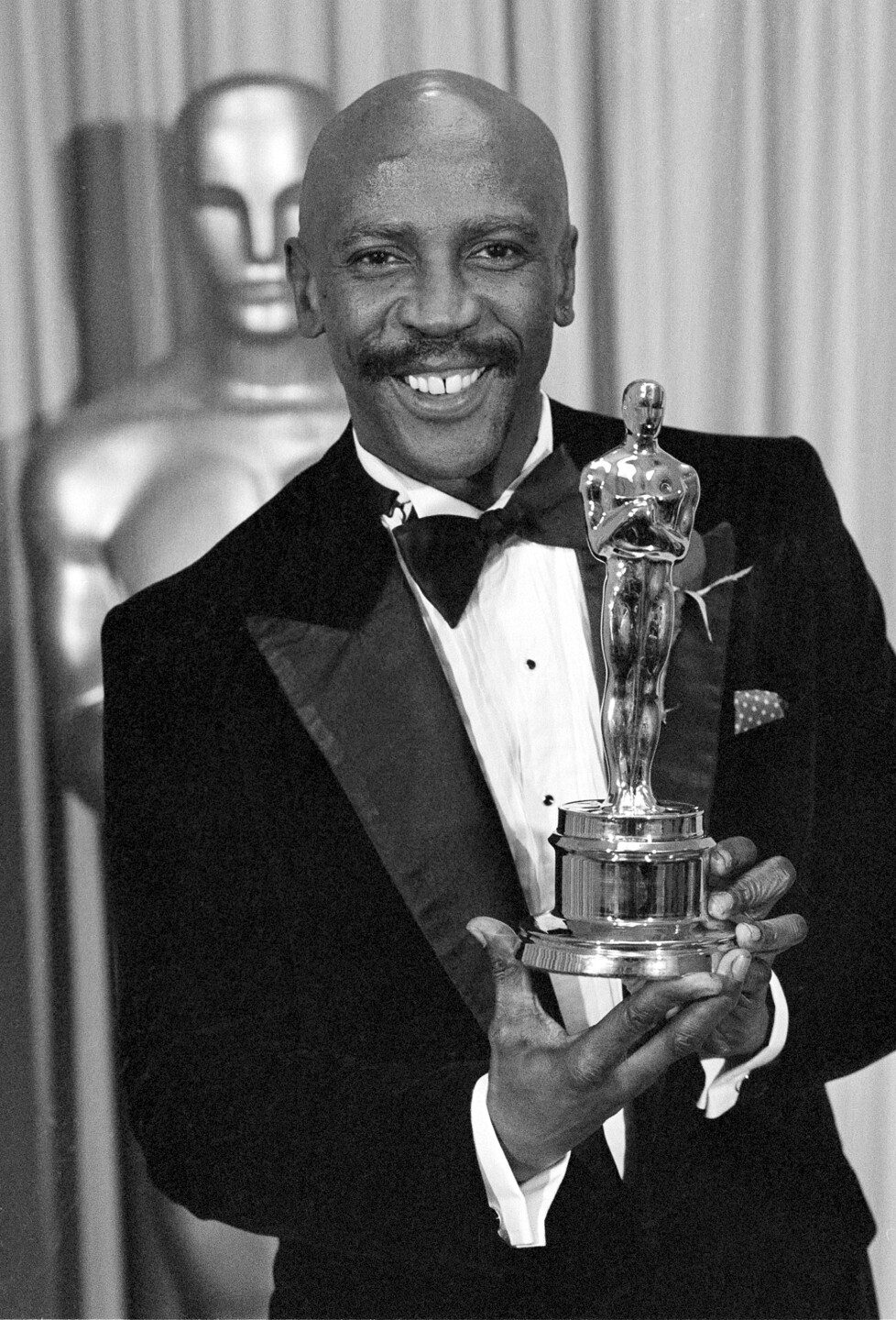 Louis Gossett Jr. holds best supporting actor Oscar for 'An Officer and a Gentleman,' April 11, 1983