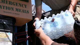 Volunteers load up a truck with supplies for residents of the Keys.