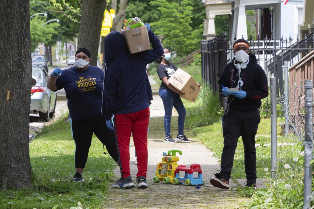 Volunteers work with McCurtis delivering care packages. Photo credit: Dan Herda, United Way