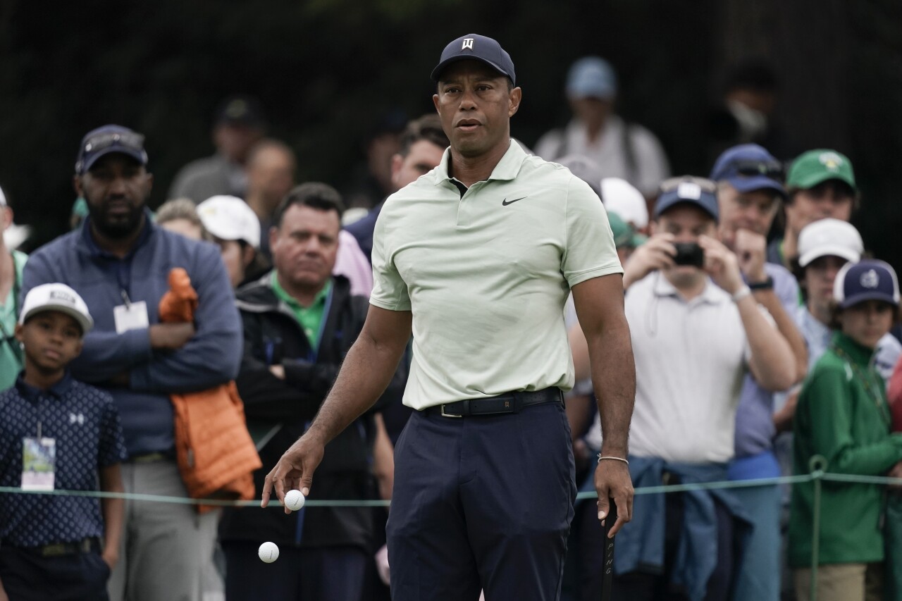 Tiger Woods drops golf balls at Masters practice round, April 5, 2022
