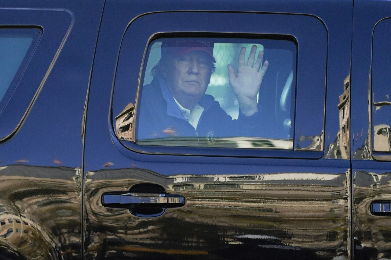 President Donald Trump waves to supporters during protests in Washington