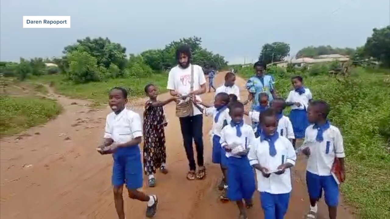 Daren Rapoport walking with his students in Nigeria.