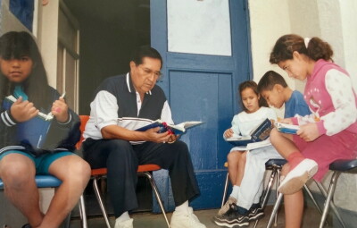 Roy Guerrero tutors kids at the Escondido Union School District. 