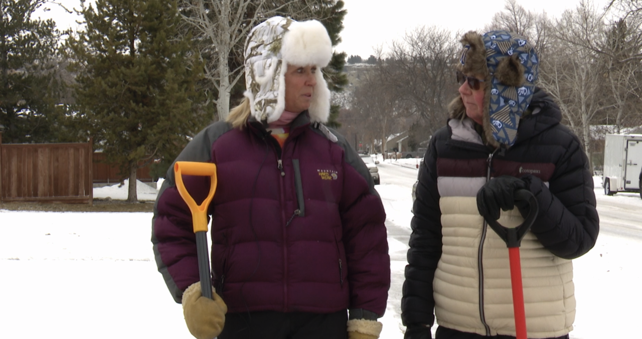 Billings neighbors shoveling Monday