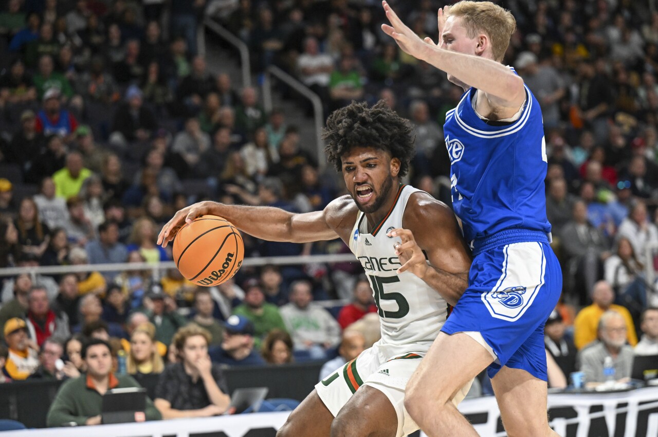Miami Hurricanes forward Norchad Omier defended by Drake Bulldogs forward Nate Ferguson in first round of NCAA tournament, March 17, 2023