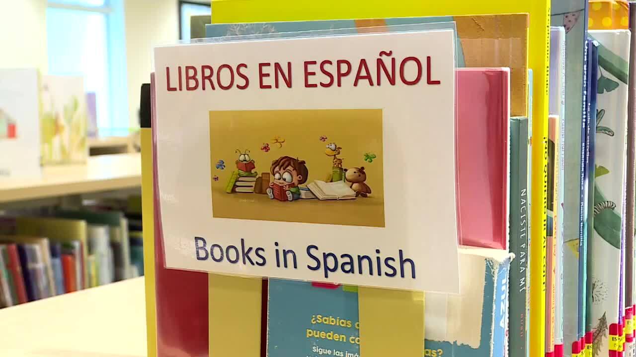 'Libros En Espanol, Books in Spanish' sign at Paula A. Lewis Branch Library
