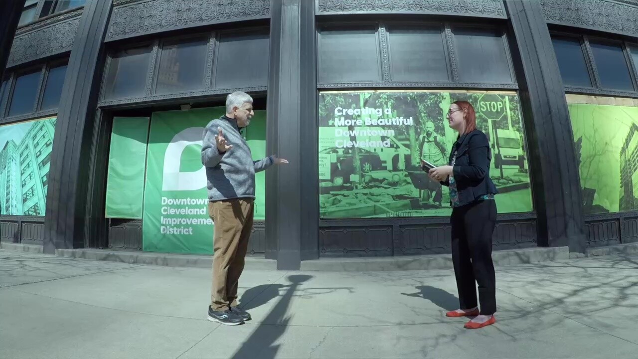 Tom Yablonsky talks to reporter Michelle Jarboe outside the Rockefeller Building.