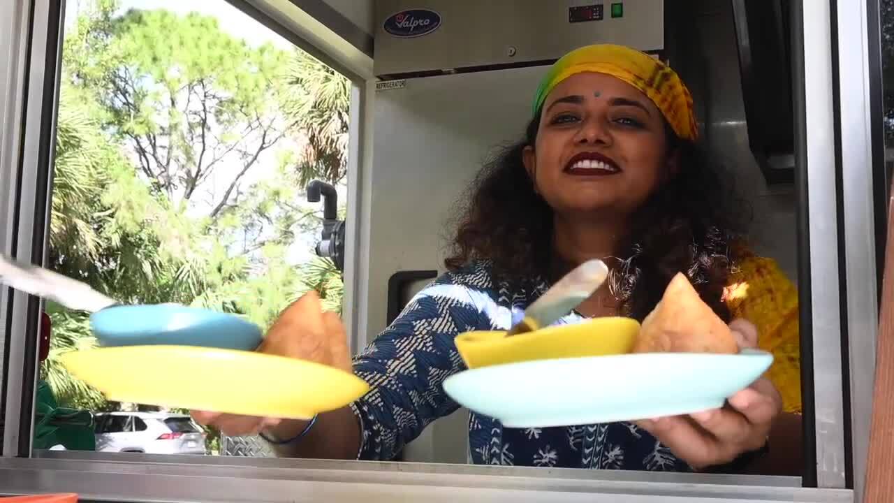 Iti Soni holding Indian cuisine she's prepared