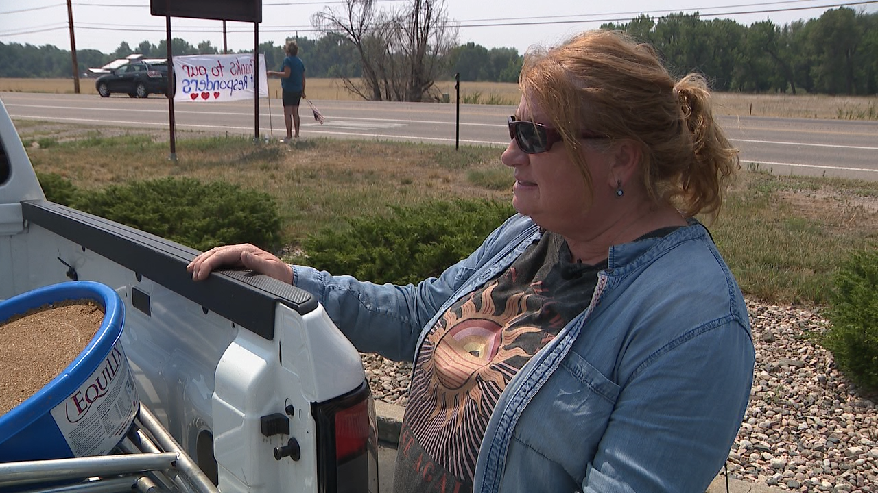 Corrine with truck of supplies.png