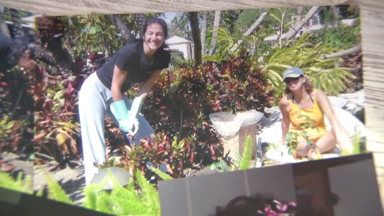 old photo of Cindy Moffett and Debbie Moffett gardening together