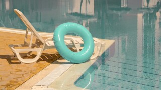 Relaxing,Summer,Moment,,Hands,Resting,On,A,Retro,Pool