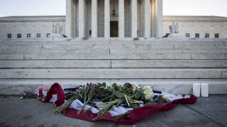Flowers sit outside the U.S. Supreme Court in honor of Antonin Scalia.