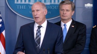 National Intelligence Director Dan Coats, left, and FBI Director Christopher Wray