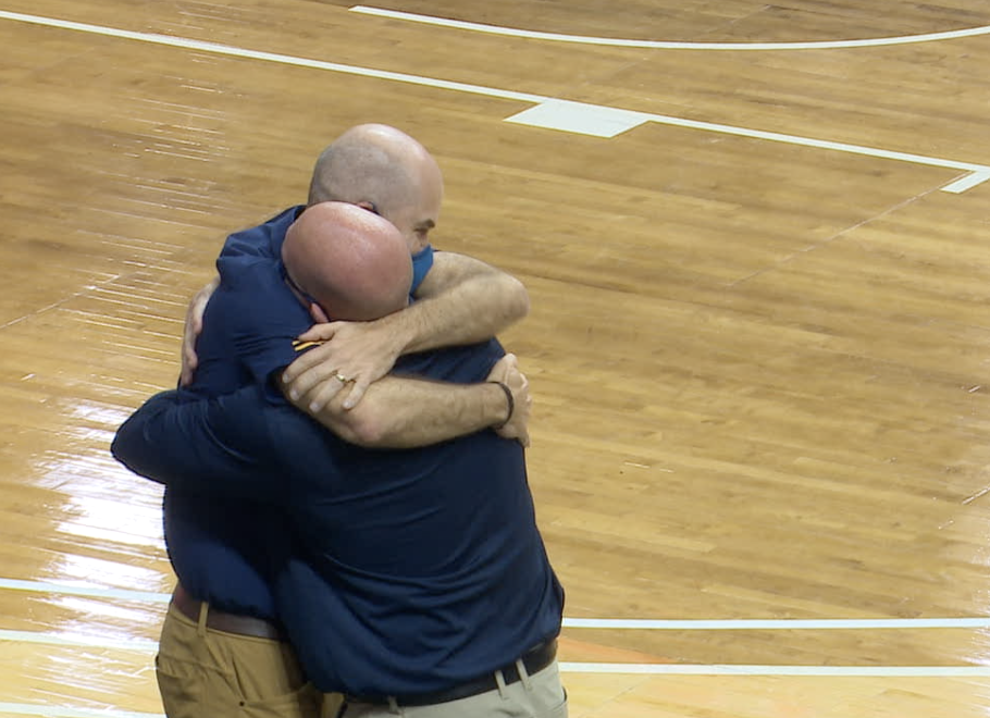 Casey Glass shares a hug after the state championship win