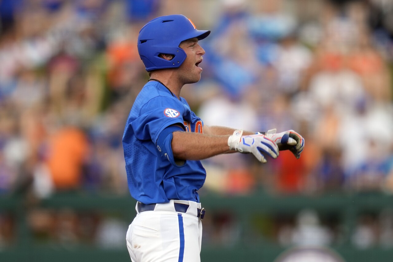 Florida Gators third baseman Colby Halter celebrates after hitting RBI double to drive in two runs against South Carolina Gamecocks in second inning, June 10, 2023