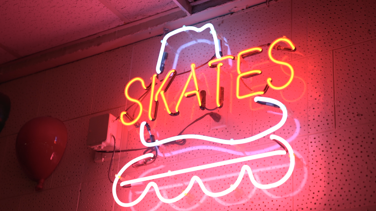 Skate sign inside of Edu roller skating rink
