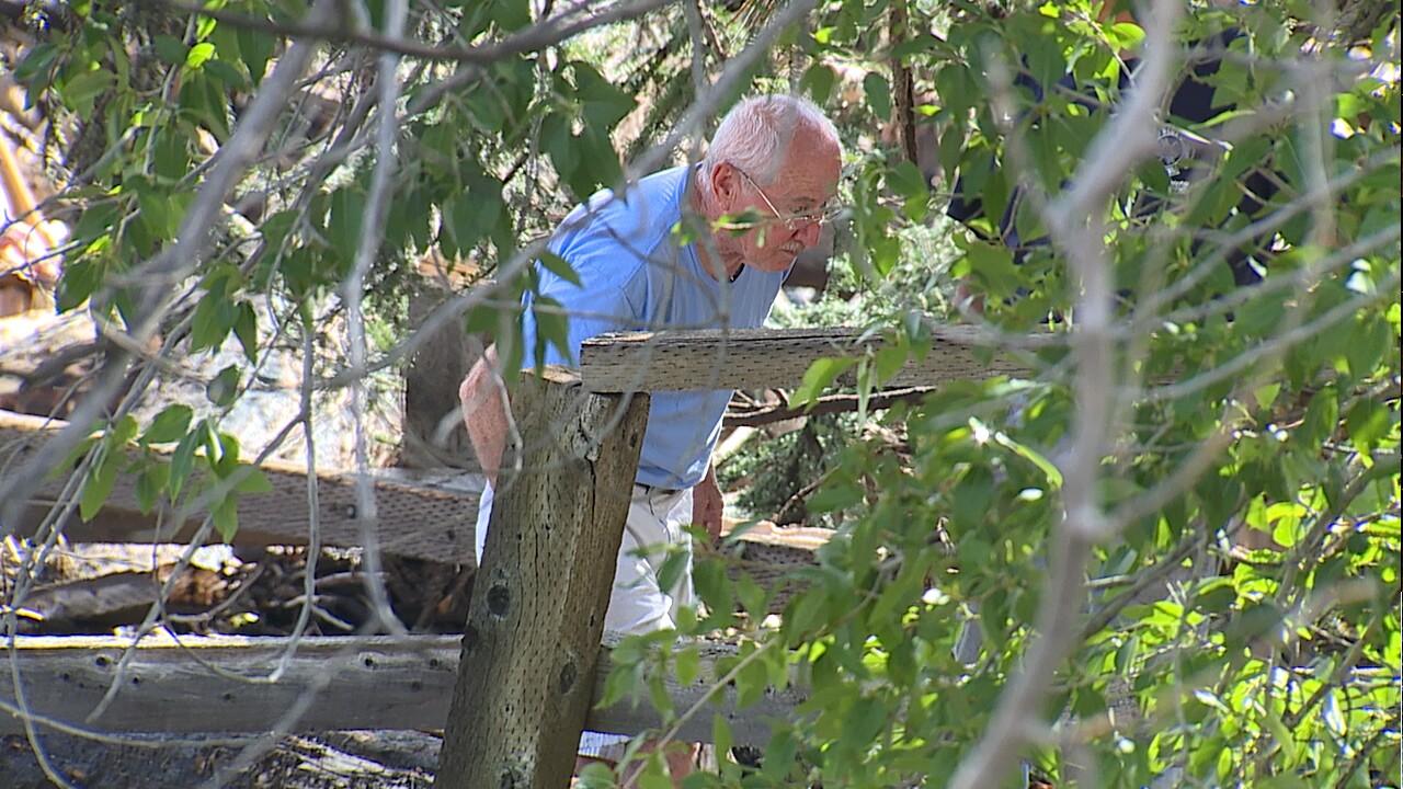 Jerry Wilkerson looking through debris