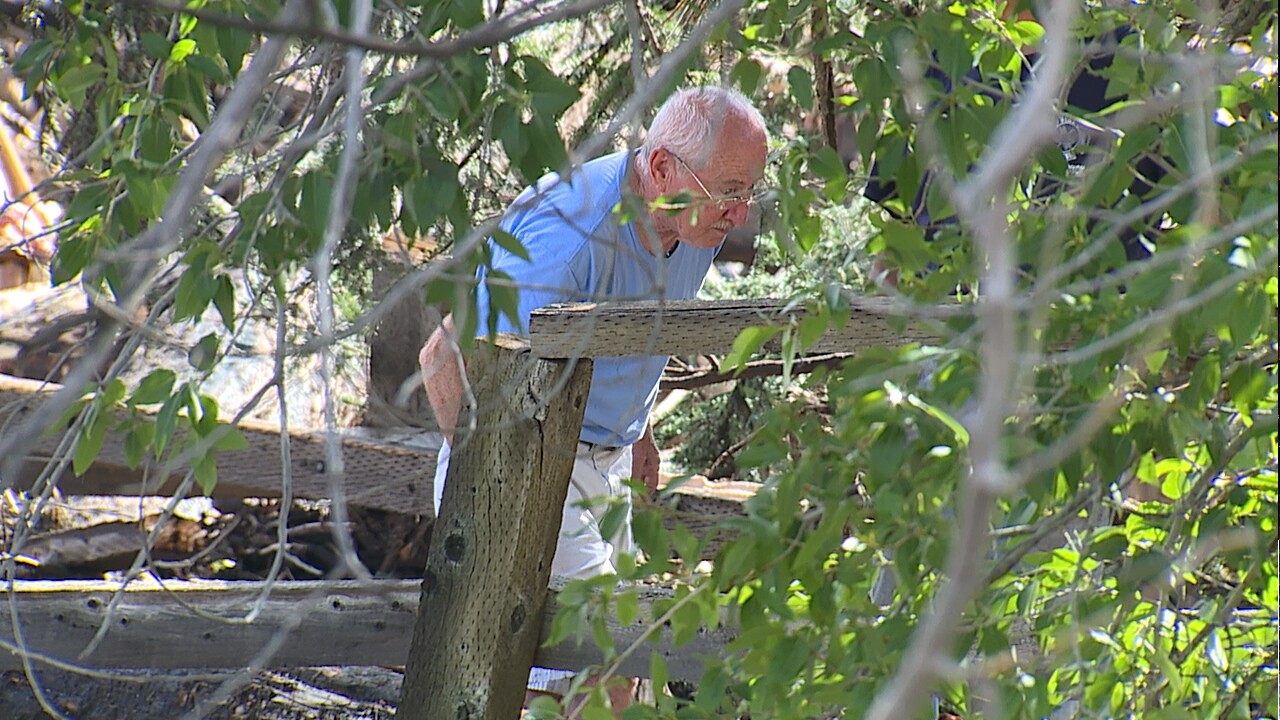 Jerry Wilkerson looking through debris 