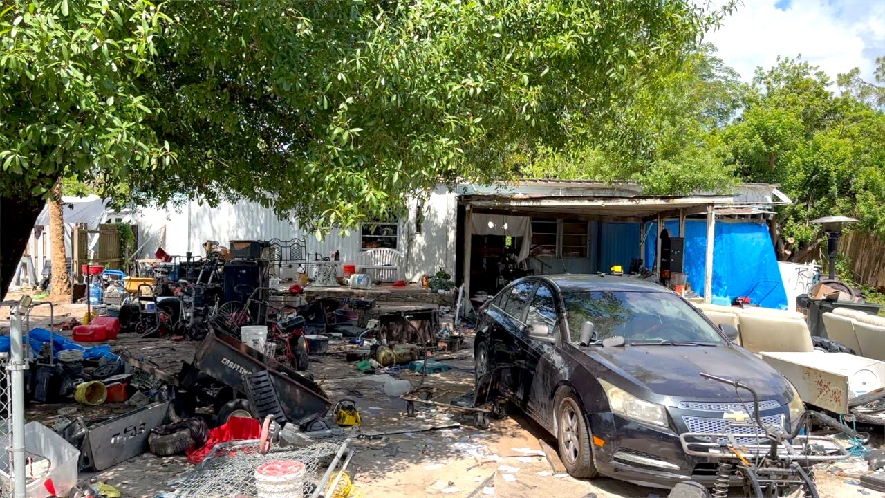 Yard filled with trash and debris