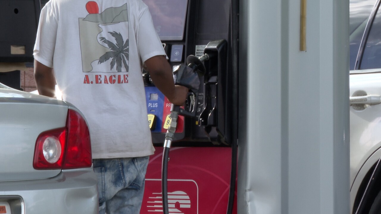 Man pumps gas at Lansing Speedway on N. Cedar Street