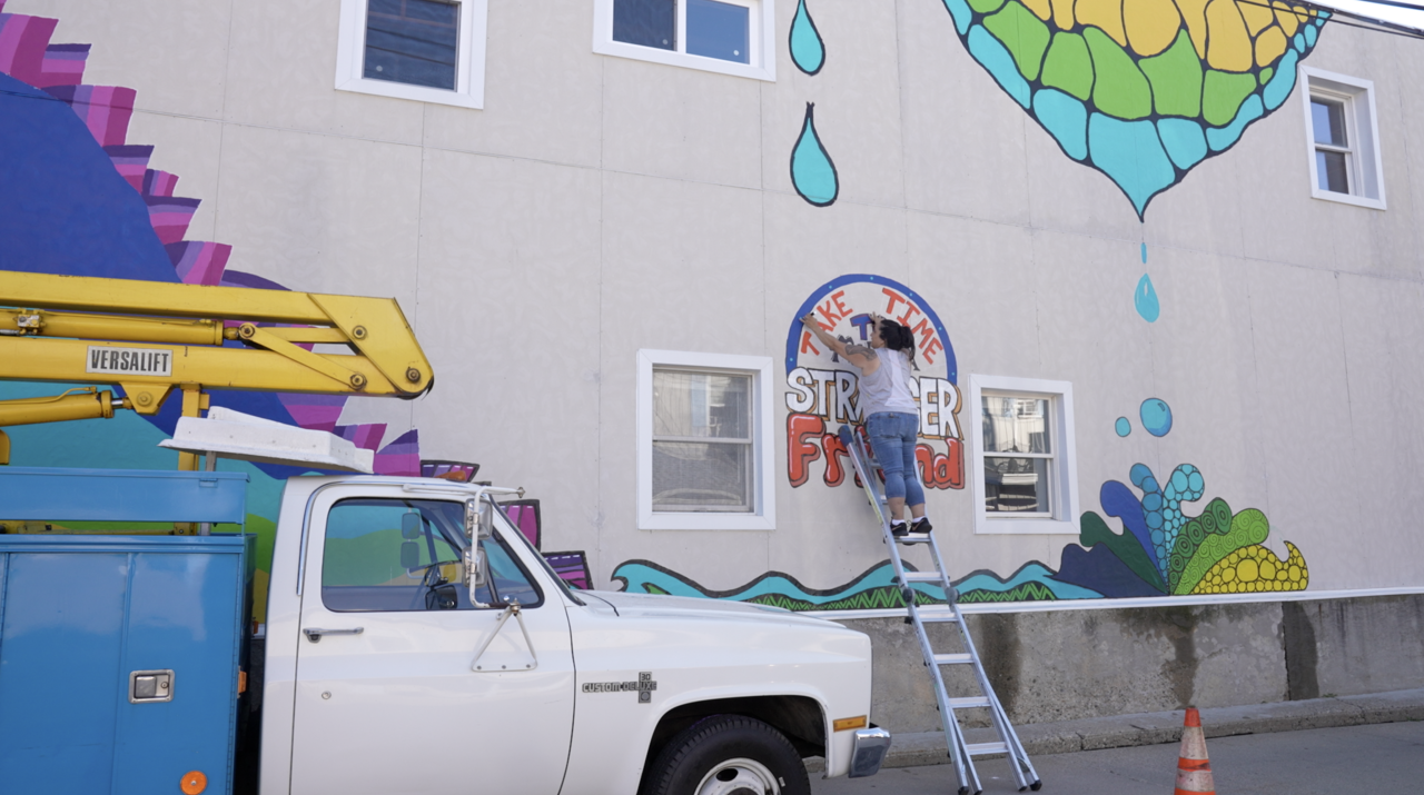 The mural Michelle is working on for Charlotte Rising is located at 114 E. Lovett Street.