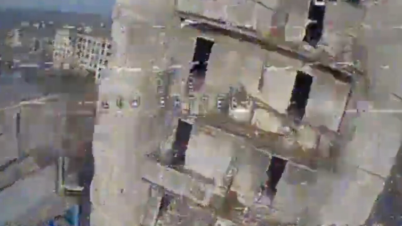 An image of a building showing open windows and bunker entries.