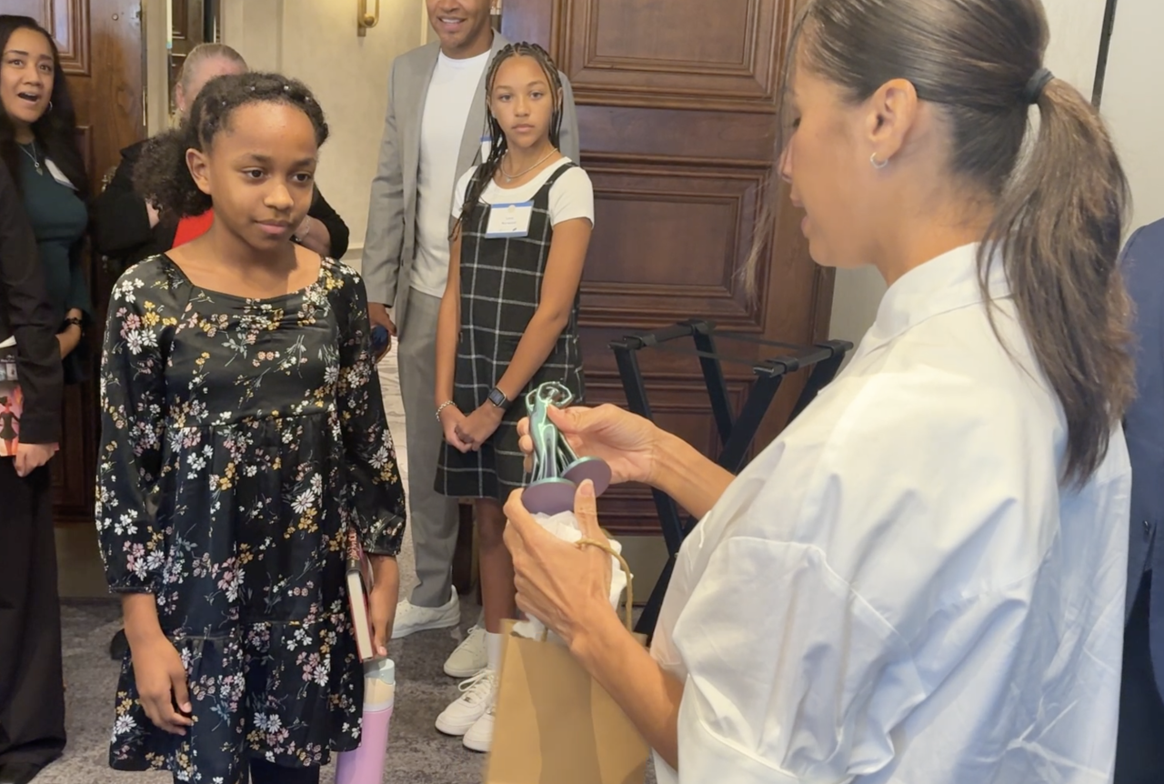 Student Gifts a hand made item to Misty Copeland