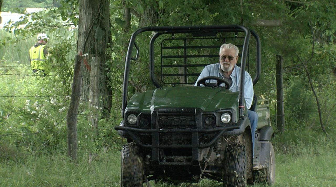 Tom Brown surveys his farm near Bethel.