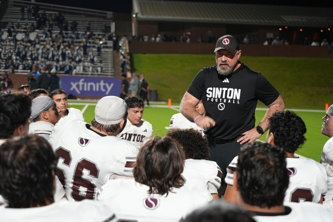 Sinton football head coach Michael Troutman talks to team after State Semifinal loss to West Orange-Stark