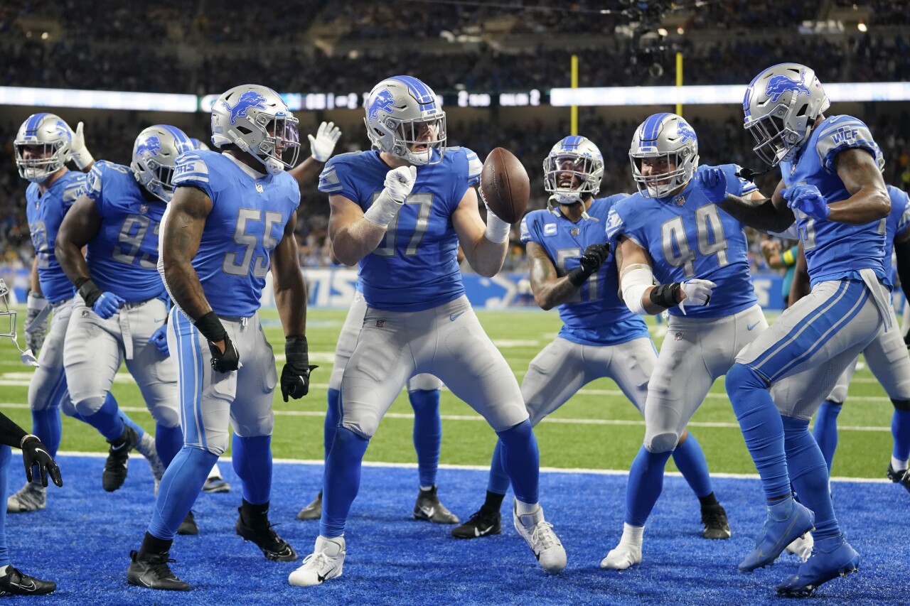 Detroit Lions defensive end Aiden Hutchinson dances with teammates after intercepting pass intended for Green Bay Packers receiver Allen Lazard, Nov. 6, 2022