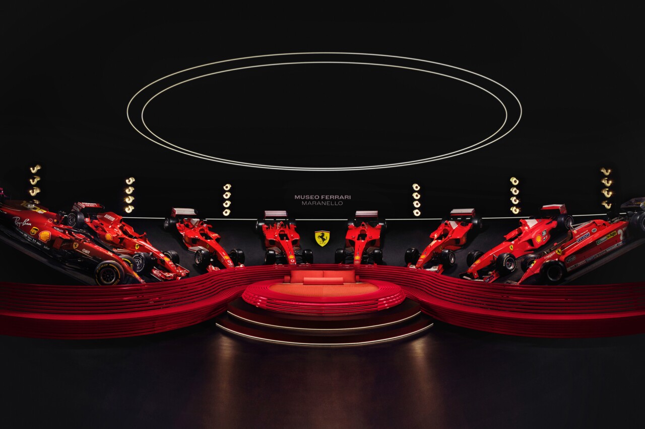Race cars lined up at the Ferrari Museum in Maranello, Italy