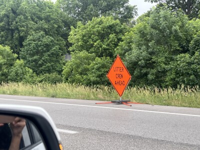 Crews cleaning up roadside litter along I-70 W near Noland Road 