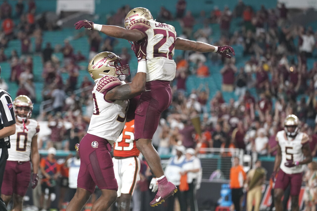 Florida State Seminoles running back CJ Campbell lifted into air by tight end DJ Daniels after scoring TD, Nov. 5, 2022