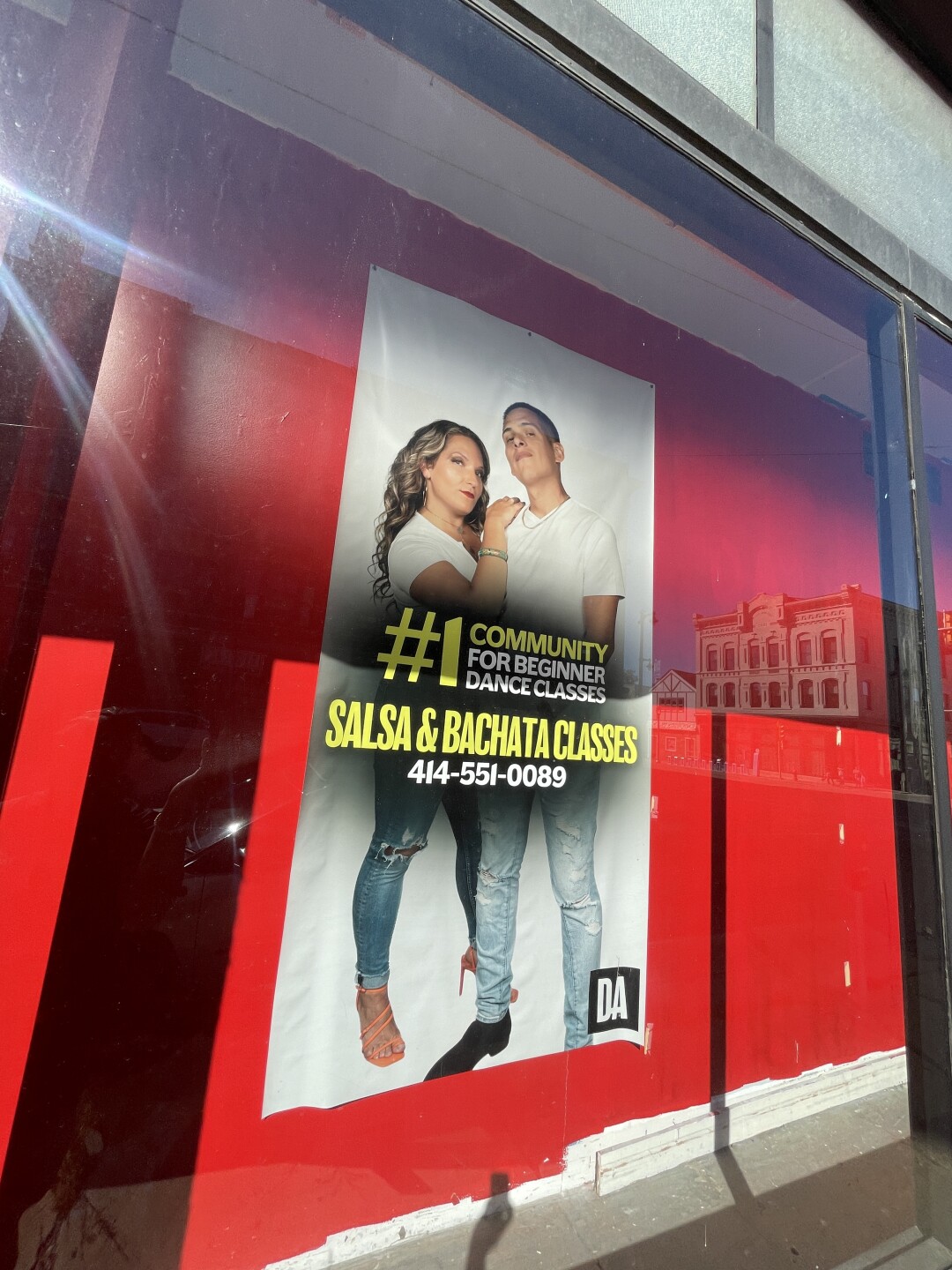 DAYNC ACADEMY CO-OWNERS PHOTO CAN BE SEEN IN THE WINDOW OF THE ACADEMY