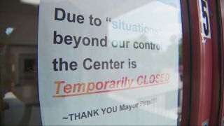 Closed sign outside Ajax
