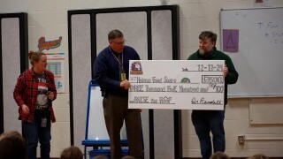 Tim taking the check