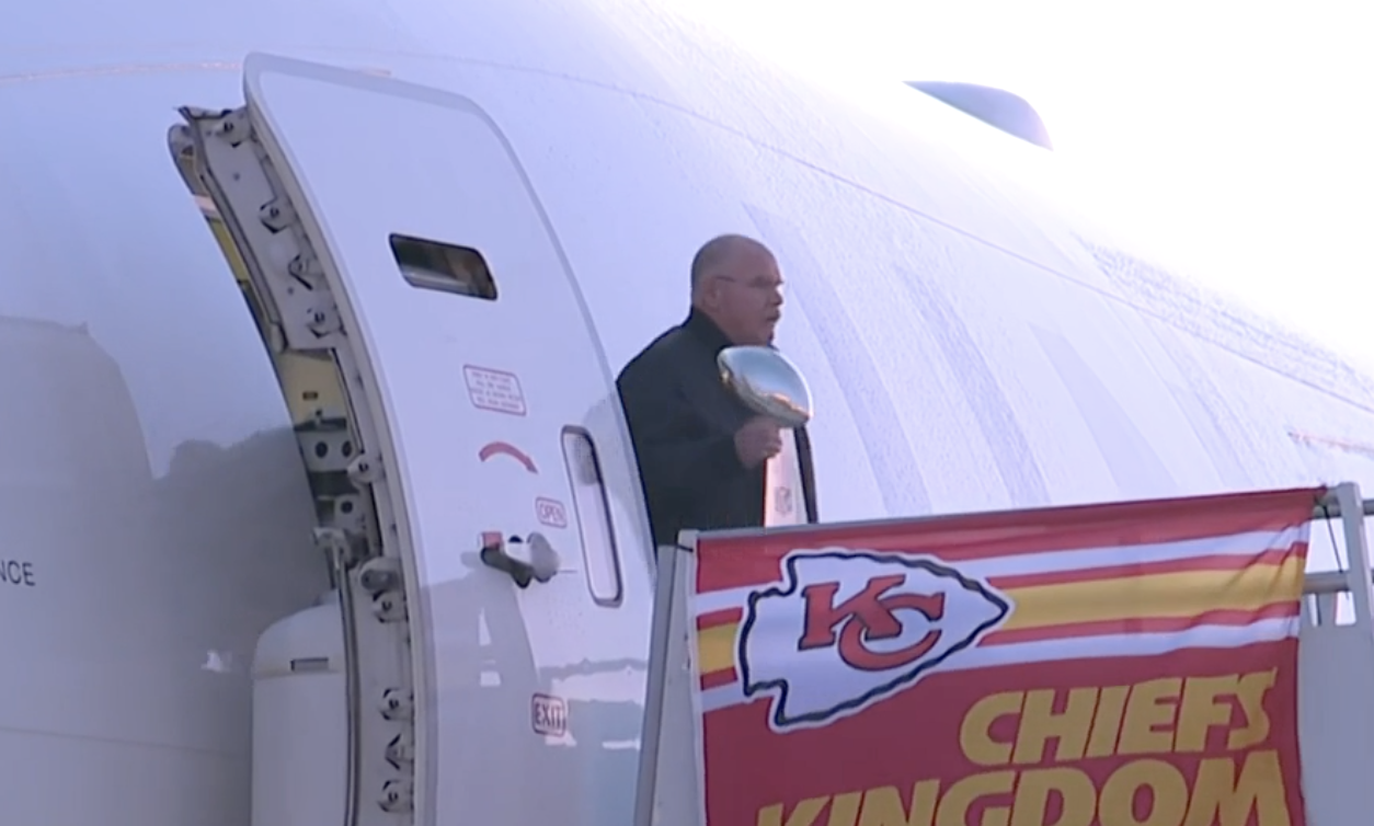 Andy Reid arrives at KCI